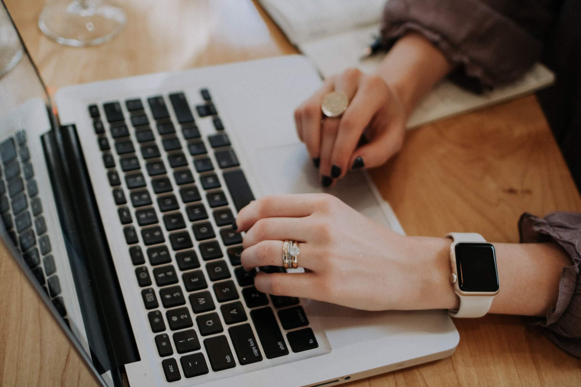 A woman sitting in front of a laptop
