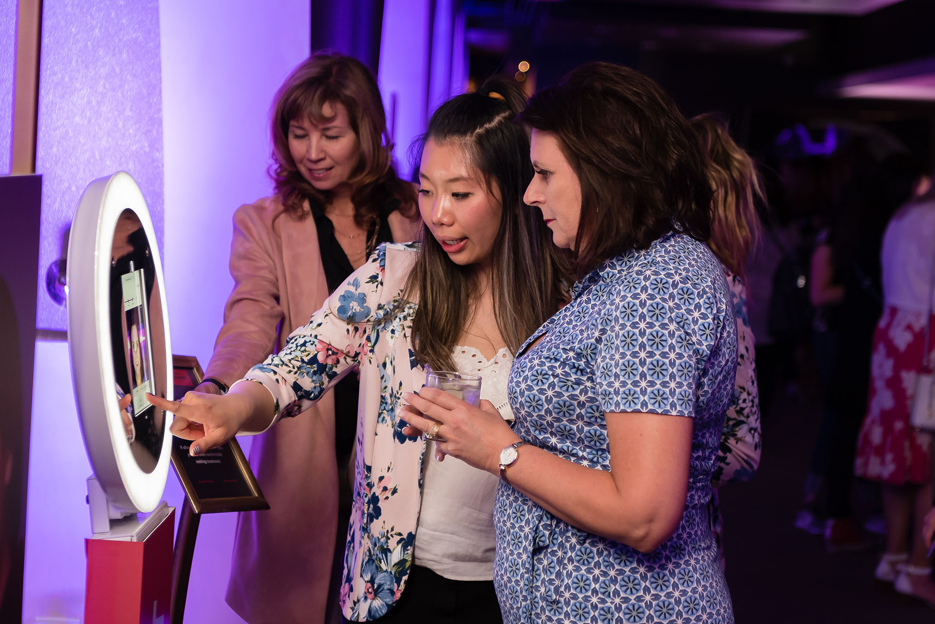 A group of women at an activation event for Juvederm