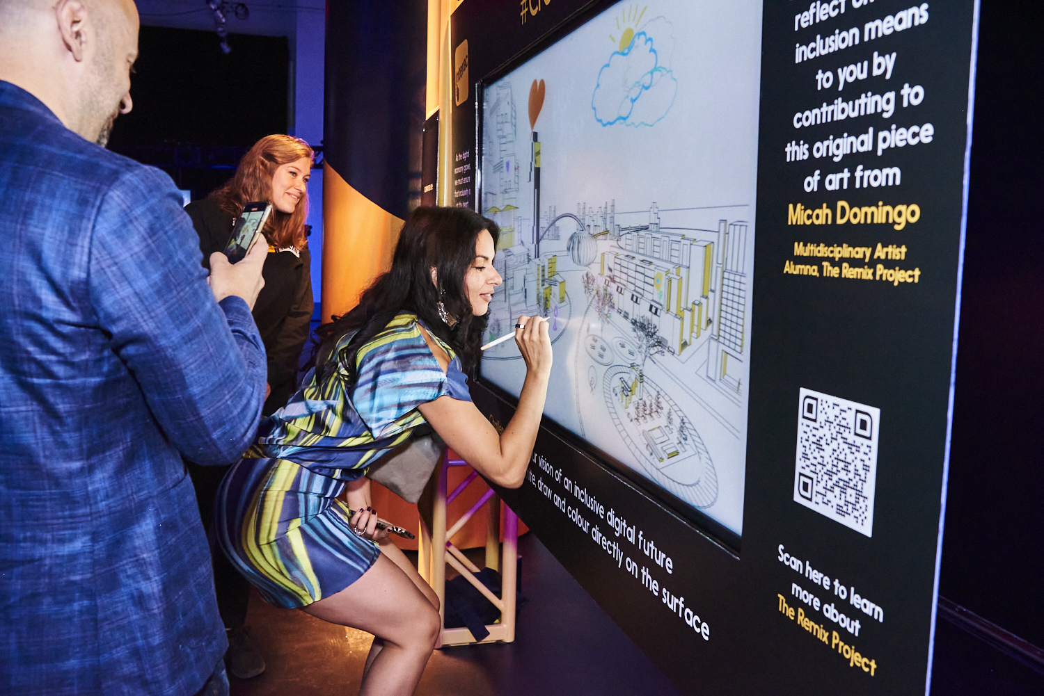 a woman writing on a large digital screen