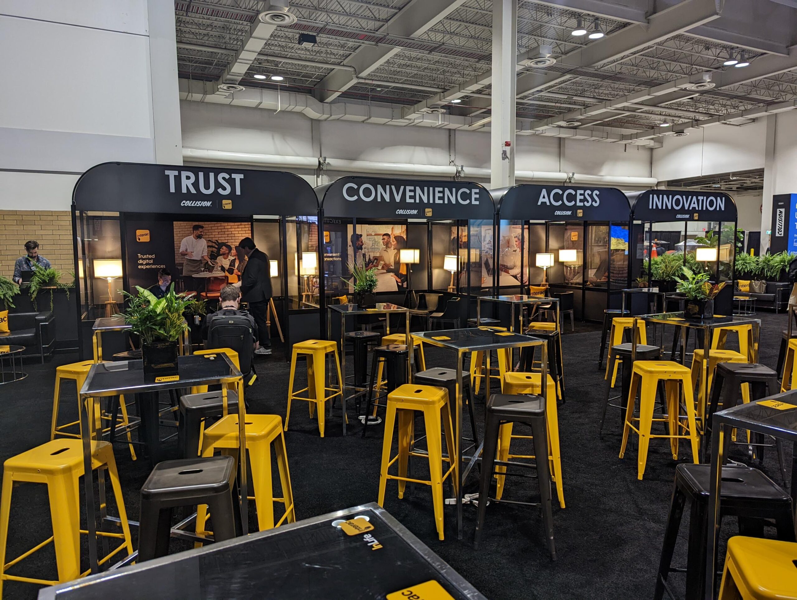 Black and Yellow table and chairs in front of booths