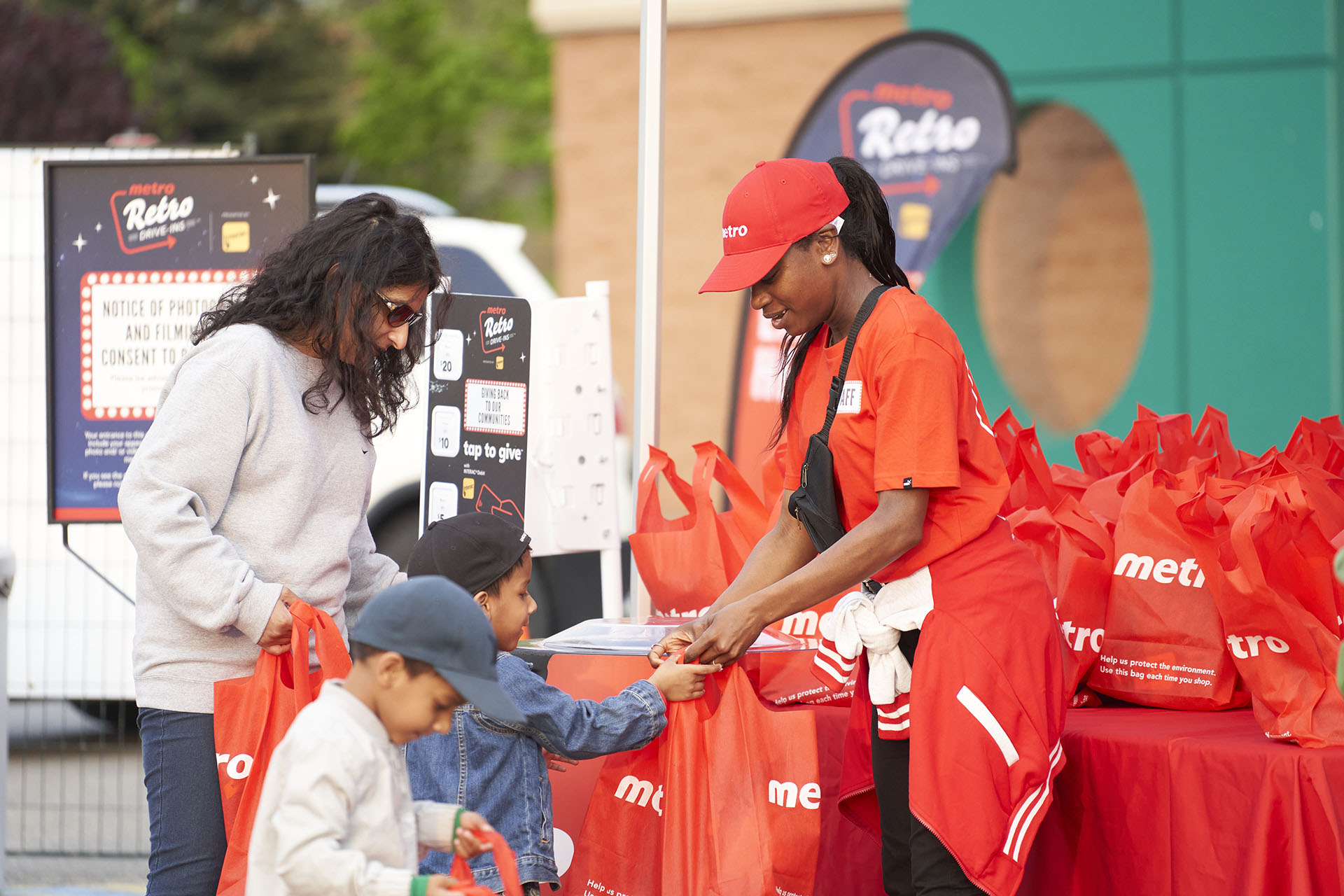 People interacting at a Metro Retro Drive-Ins event