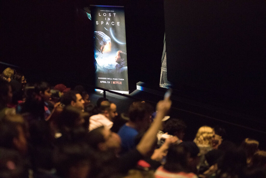 a group of people in a large theatre