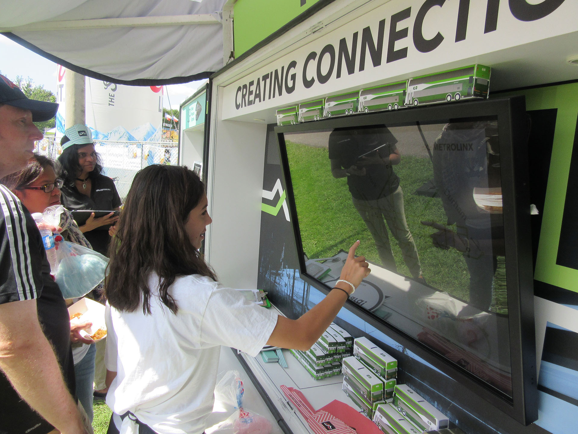 Person playing with TV game at Aurora Ribfest