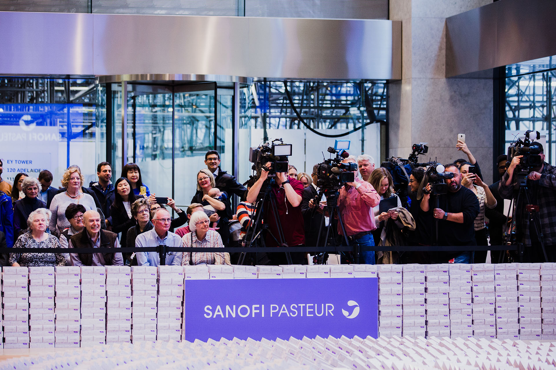 A group of seniors sitting beside a group of camera people