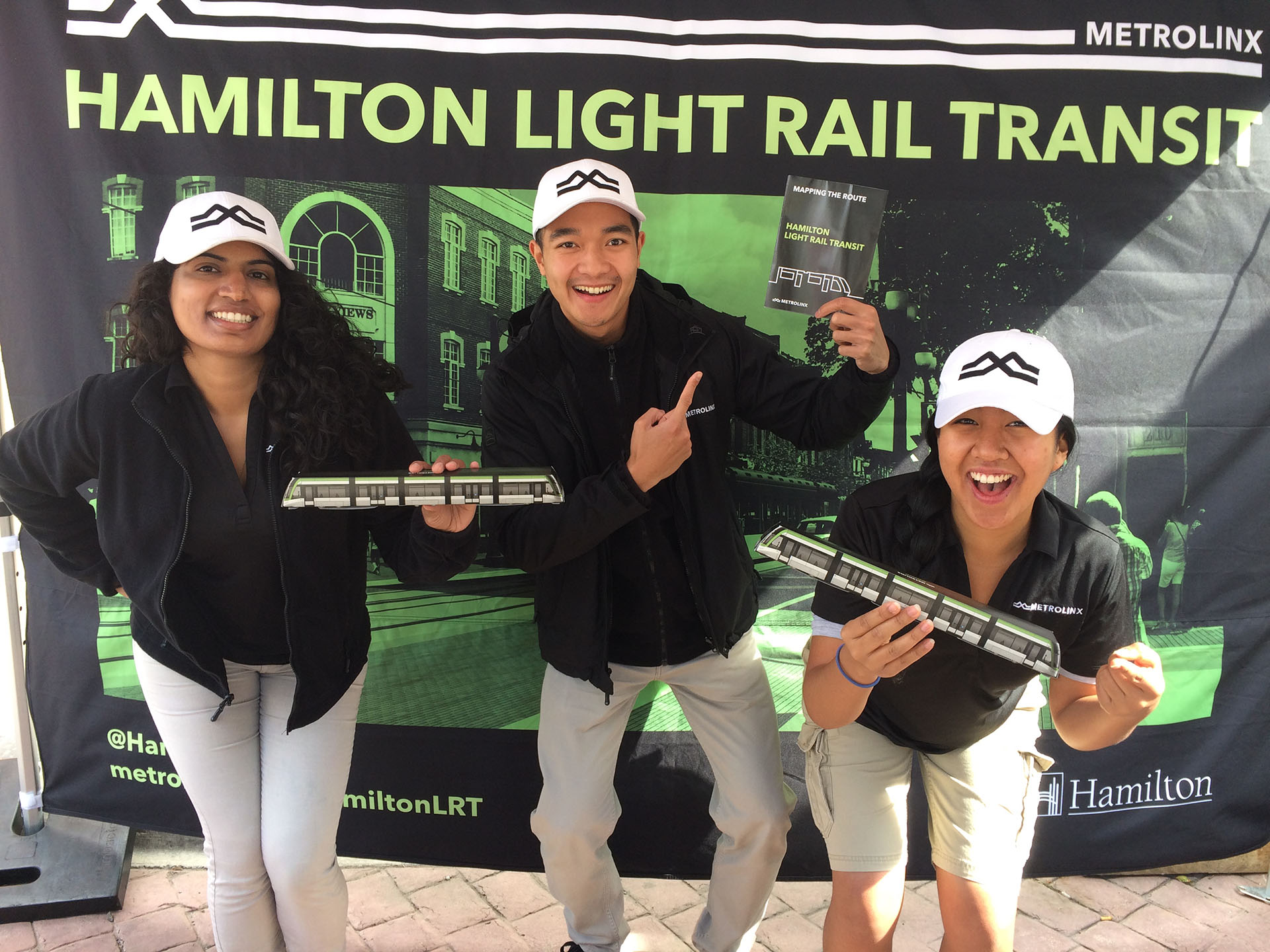 A group of brand ambassadors standing in front of a Metrolinx sign